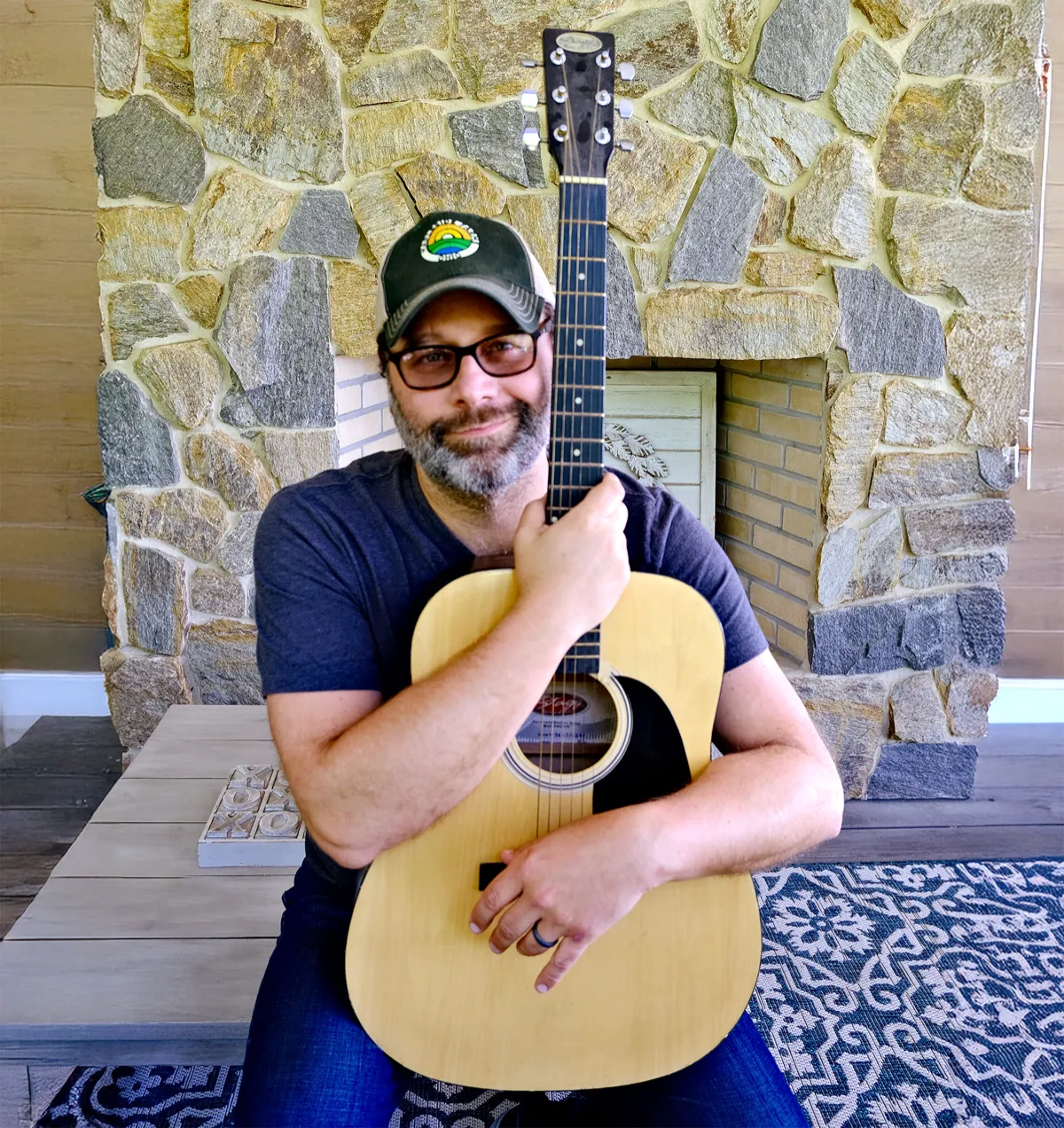 Galen Marten playing acoustic guitar